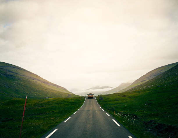 Car driving on empty highway